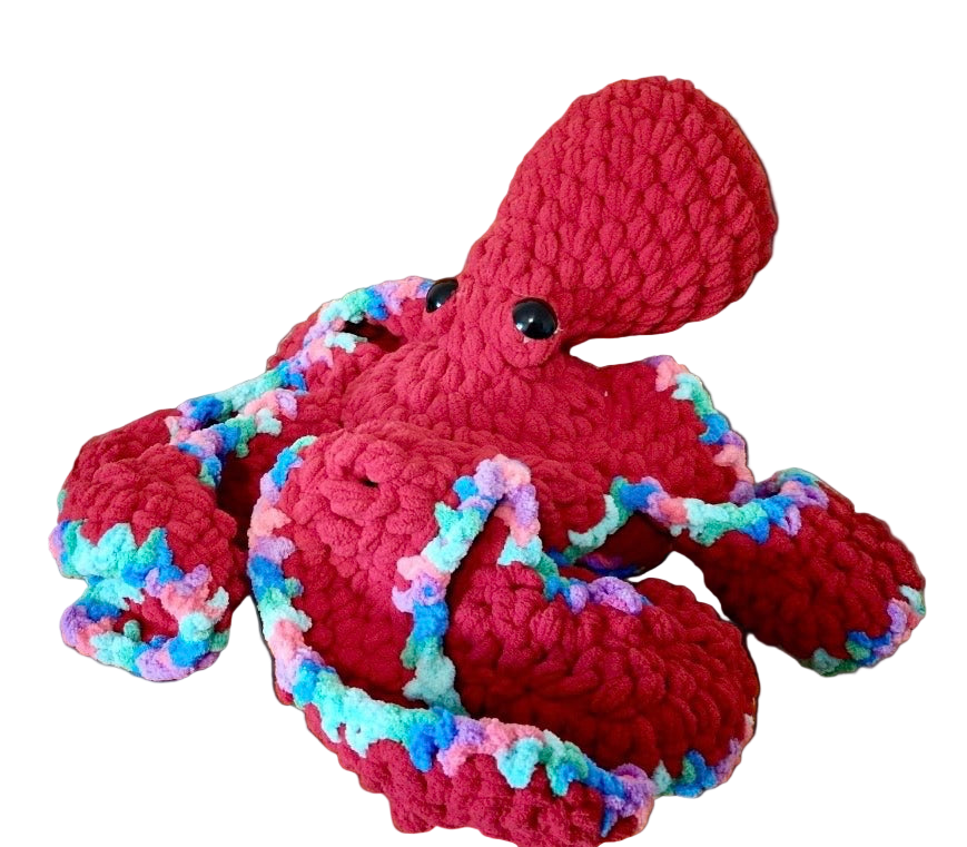 Large red crochet octopus with variegated blue, pink, and aqua multicolored tentacle undersides.